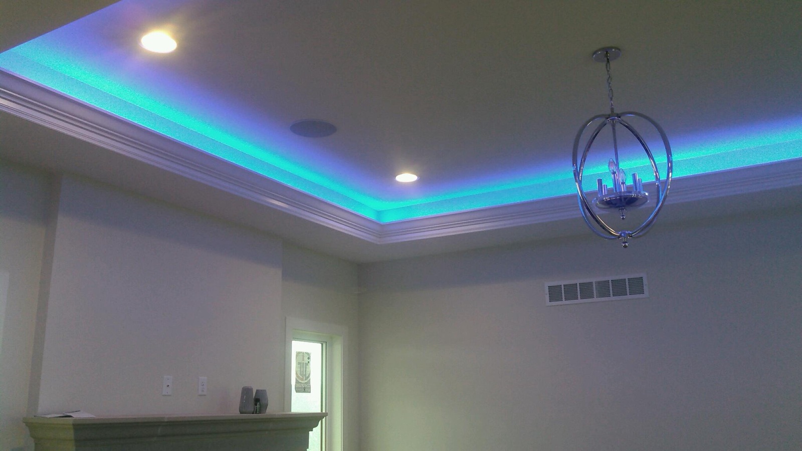 Teal LED along a crown moulding tray