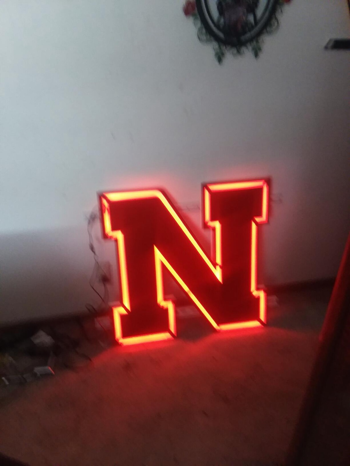 Lit red Nebraska N sign