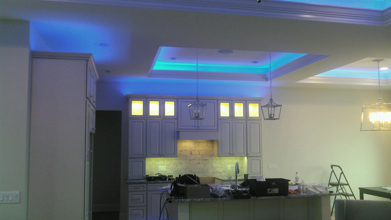 Kitchen mid-install with blue LED in the ceiling