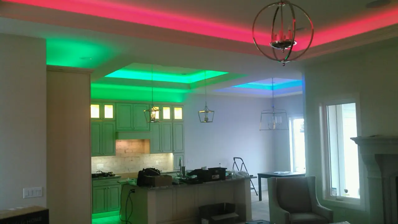 Kitchen and living room with red, green and blue LED in the ceiling