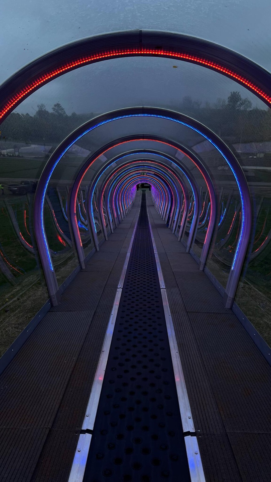Walkway lined with lit LED arches