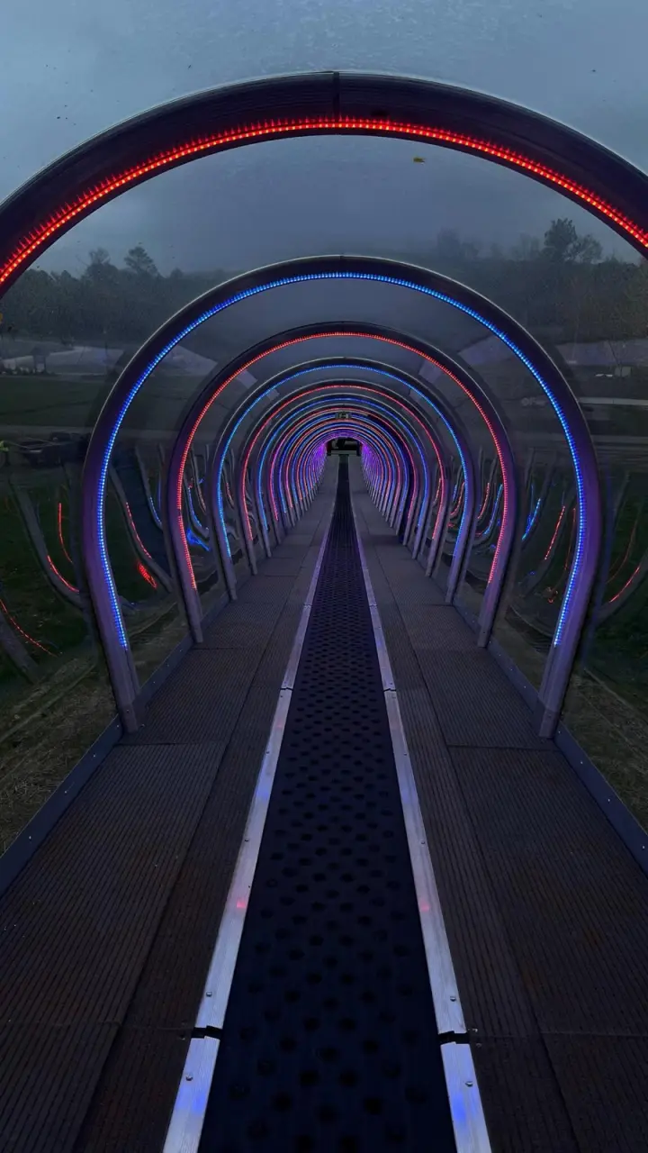 Walkway lined with lit LED arches